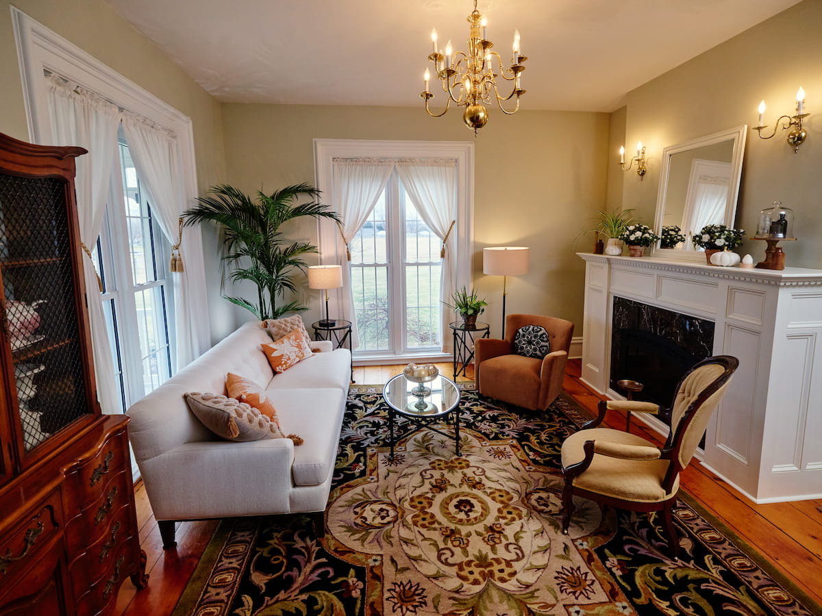 Parlor with mix of modern furniture and 1800s vintage details